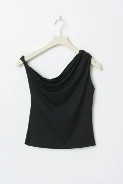 Asymmetric micro top
